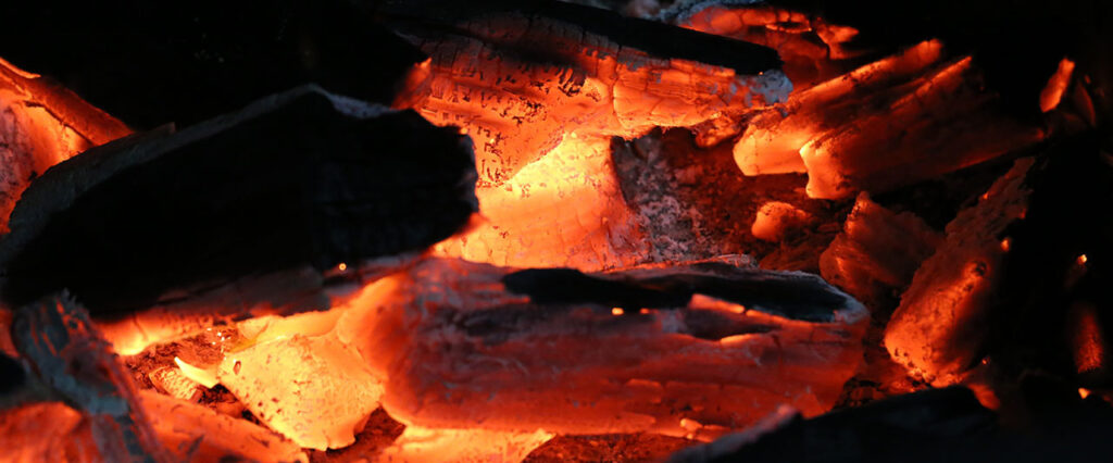 glowing coal in a barbecue in brazil. close up.